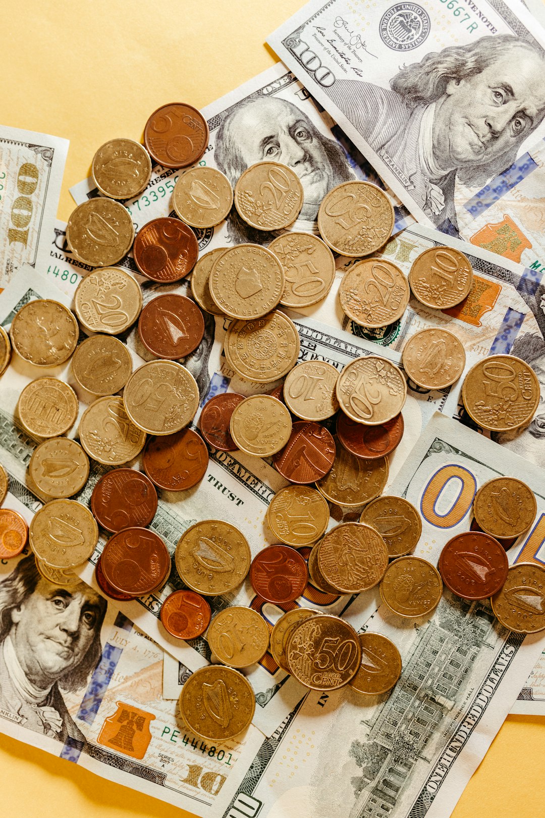 a-pile-of-money-sitting-on-top-of-a-table-bleomjofl1y